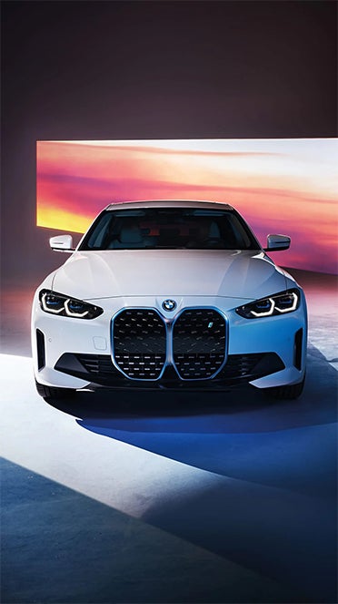 White BMW i4 with colorful background